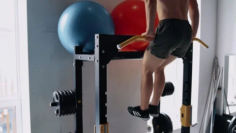 The young man performs the lifting of the body upwards with the help of the Stock Footage 156508837