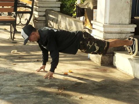 A young man performs push-ups 写真素材