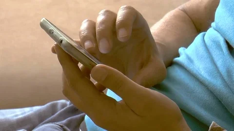 Young man with phone in hand Stock Footage 78306590