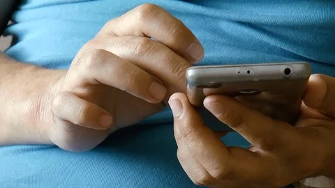 Young man with phone in hand Stock Footage 78420490