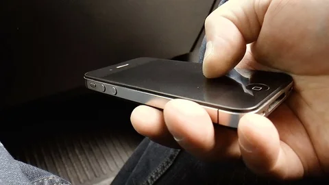 Young man with phone in hand Stock Footage 78661744