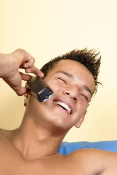 Young man on the phone Stock Photos
