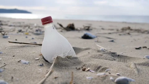 Young man pick up plastic on sea shore,clean up ecosystem pollution concept Stock Footage 120882927