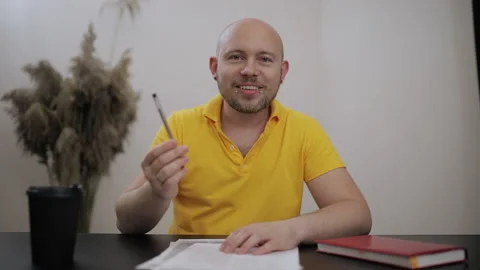 Young man with piercing on face, coach or teacher checking test Stock Footage 199518296