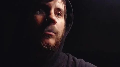 Young man with piercings performs vaping tricks Stock Footage 142393880