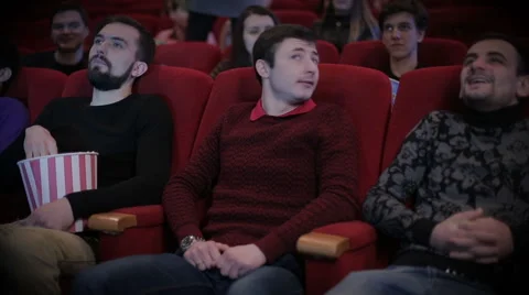 Young man pirating at the cinema Stock Footage 61966514