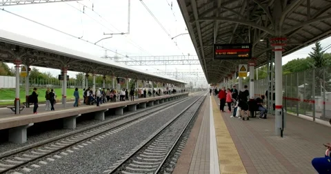 The young man on the platform waiting for the train's arrival Stock Footage 67469698