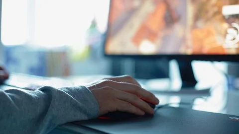 Young man play game using mouse. Closeup Stock Footage 72978631