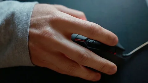 Young man play game using mouse. Closeup. Stock Footage 77125078