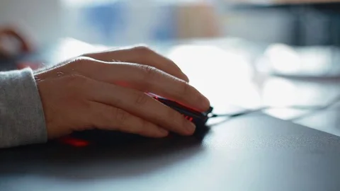 Young man play game using mouse. Closeup shoot of the hand. Stock Footage 77405632