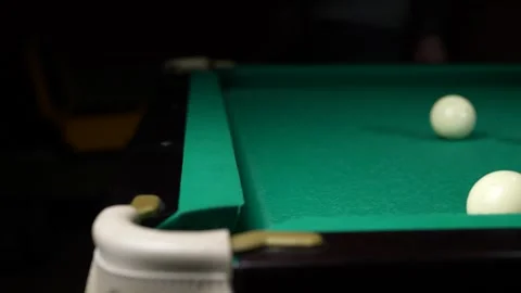 Young man playing American billiard pool poule close-up. Colorful balls on green Video stock 304971024