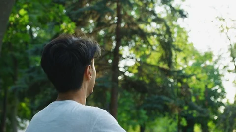 Young man playing badminton Stock Footage 99965539