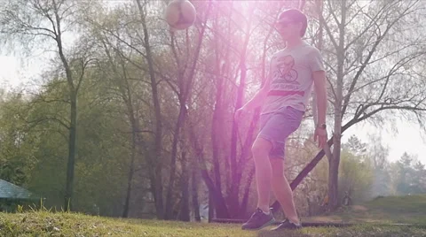The young man playing with a ball on the background of nature Video stock 64043358