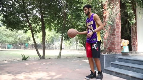 Young Man Playing with Basket ball in His home Ground for fitness Stock Footage 144261893