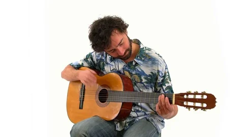 Young Man Playing Classical Guitar and Practicing Isolated White Background Stock Footage 76517559
