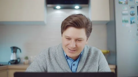 Young man playing computer game on laptop Stock Footage 148833519