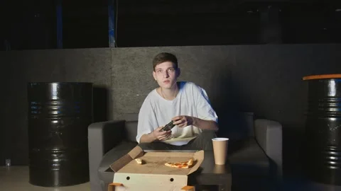 Young man playing console game in front of camera, beating his opponent online Stock Footage 136341289