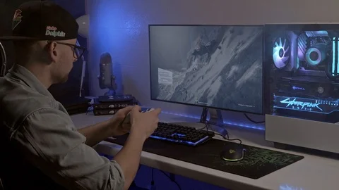 A young man is playing a console. gamer is playing on the gamepad. Stock Footage 127058425
