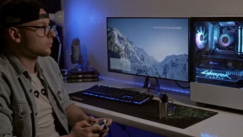 A young man is playing a console. gamer is playing on the gamepad. gamer pla Stock Footage 127058683