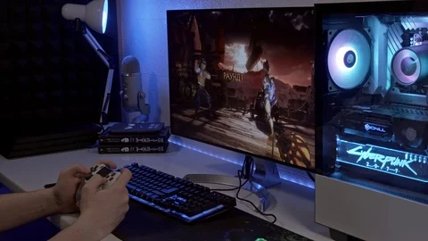 A young man is playing a console. gamer playing a gamepad Stock Footage 127059955