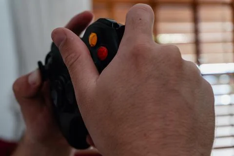 Young man playing with a console Stock Photos