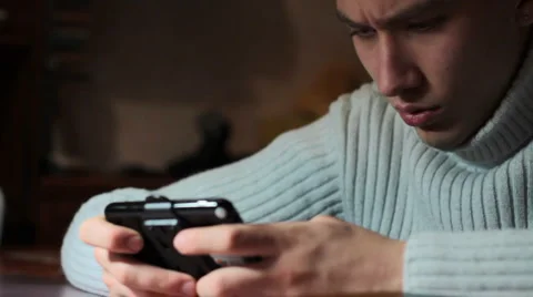 Young man playing on console. slider shot. Video stock 1103910