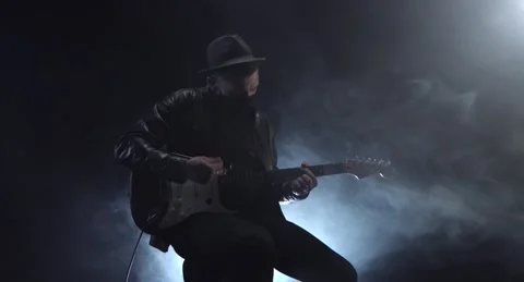 Young man playing dynamic melody wearing medical mask Stock Footage 153918550