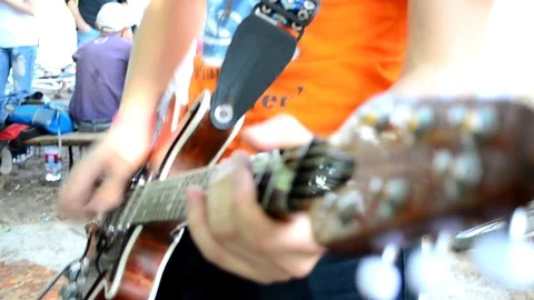 Young man playing on electric guitar close up Stock Footage 73908321