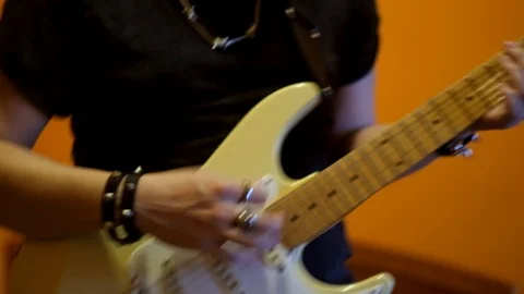 Young man playing electric guitar Stock Footage