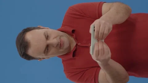 Young man playing game with cell phone. Stock Footage 151992873