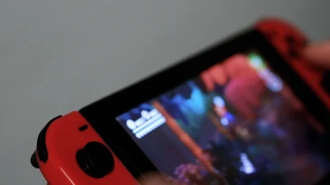 Young Man Playing Game On Nintendo Switch console,videogame addiction Stock Footage 126998924
