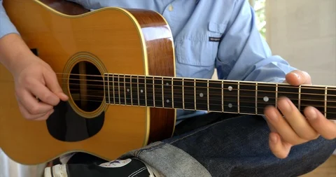 Young man playing guitar. 스톡 동영상 88375194
