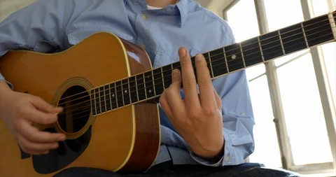Young man playing guitar. Stock Footage 88375205