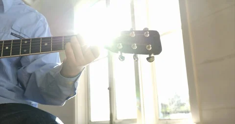 Young man playing guitar. 스톡 동영상 88375334