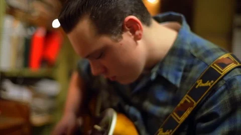 Young man playing guitar. Stock-Footage 88407174