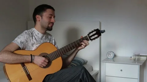 Young Man Playing Guitar Stock Footage 148788554