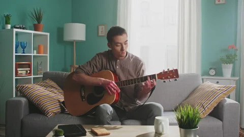 Young Man Is Playing Guitar Stock Footage 156744455