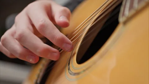 Young man is playing a guitar. Vídeo Stock 301308944