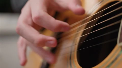 Young man is playing a guitar. Stock Footage 301309000