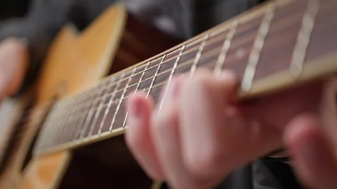 Young man is playing a guitar. Stock Footage 301309010