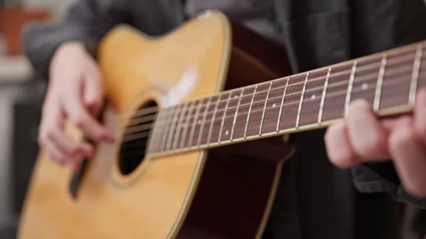 Young man is playing a guitar. Stock Footage 301309283