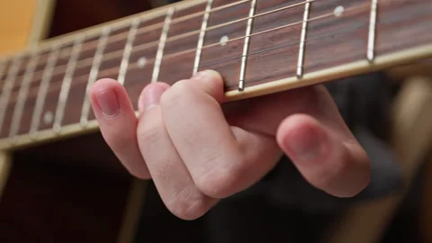 Young man is playing a guitar. Stock Footage 301309707