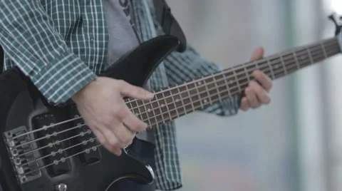Young man playing the guitar hands closeup Stock Footage 57693063