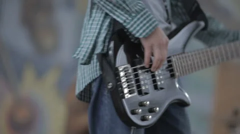 Young man playing the guitar hands closeup Stock Footage 57693463
