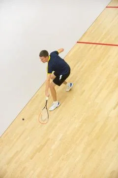 Young man playing match of squash Foto stock