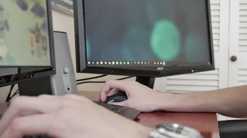 A young man playing a PC computer game Stock Footage 75486250