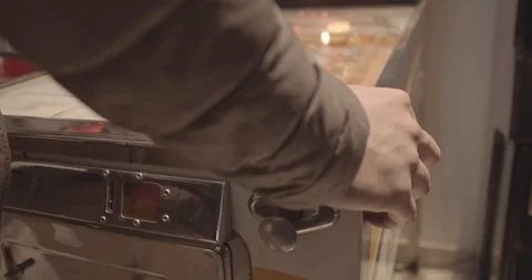 Young Man Playing With A Pinball Machine 1 Stock Footage 115558493