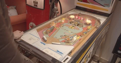 Young Man Playing With A Pinball Machine 2 Stock Footage