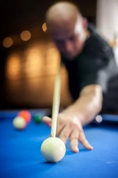 Young man playing pool game in pub Stock Photos