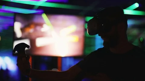 Young man playing using wearing virtual reality glasses VR goggles video game Stock Footage